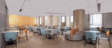 Un espace de restauration moderne avec des tables et des chaises rondes, un coin salon aux lignes courbes et de grandes fenêtres laissant entrer la lumière naturelle.