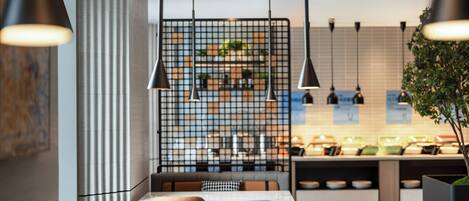 A modern restaurant with a grid-patterned partition, pendant lighting, and a counter with various dishes.