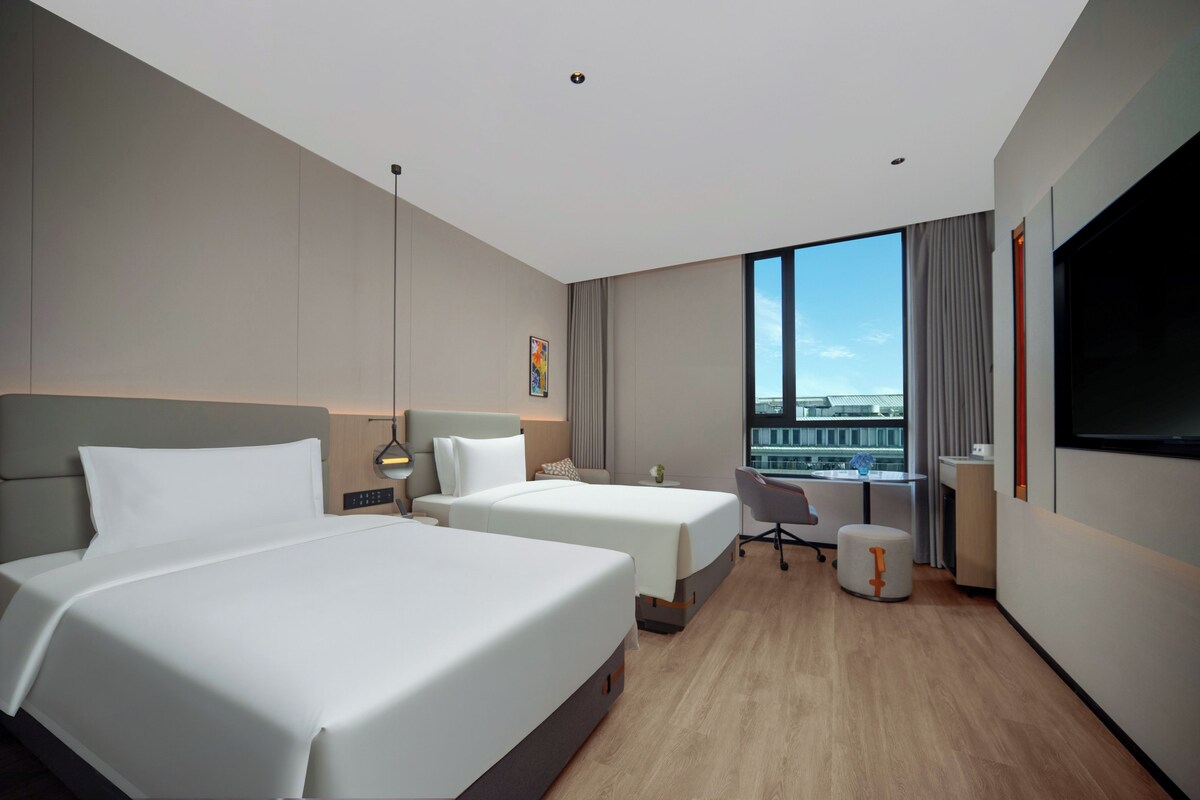 Premium bedding, down duvets, laptop workspace, blackout curtains