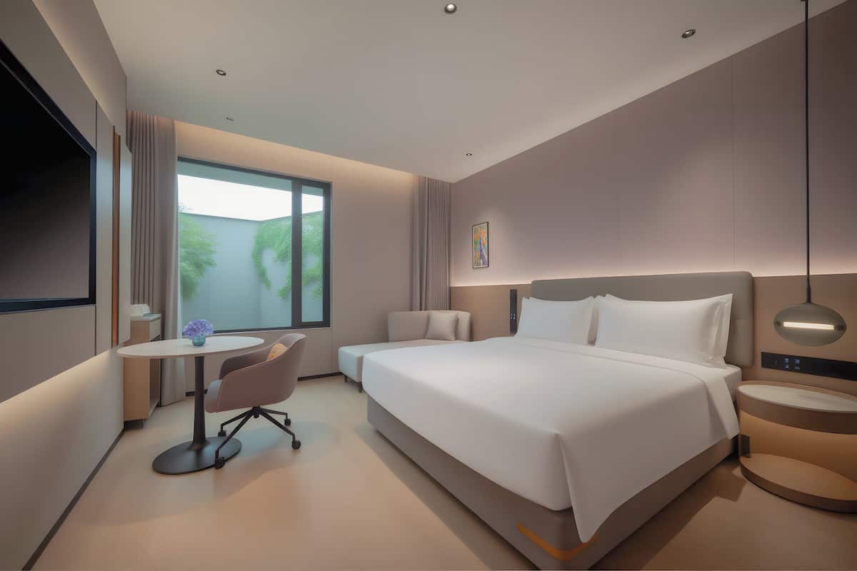 1 King Standard | Premium bedding, down comforters, laptop workspace, blackout drapes