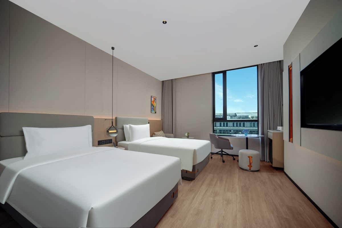 Premium bedding, down duvets, laptop workspace, blackout curtains