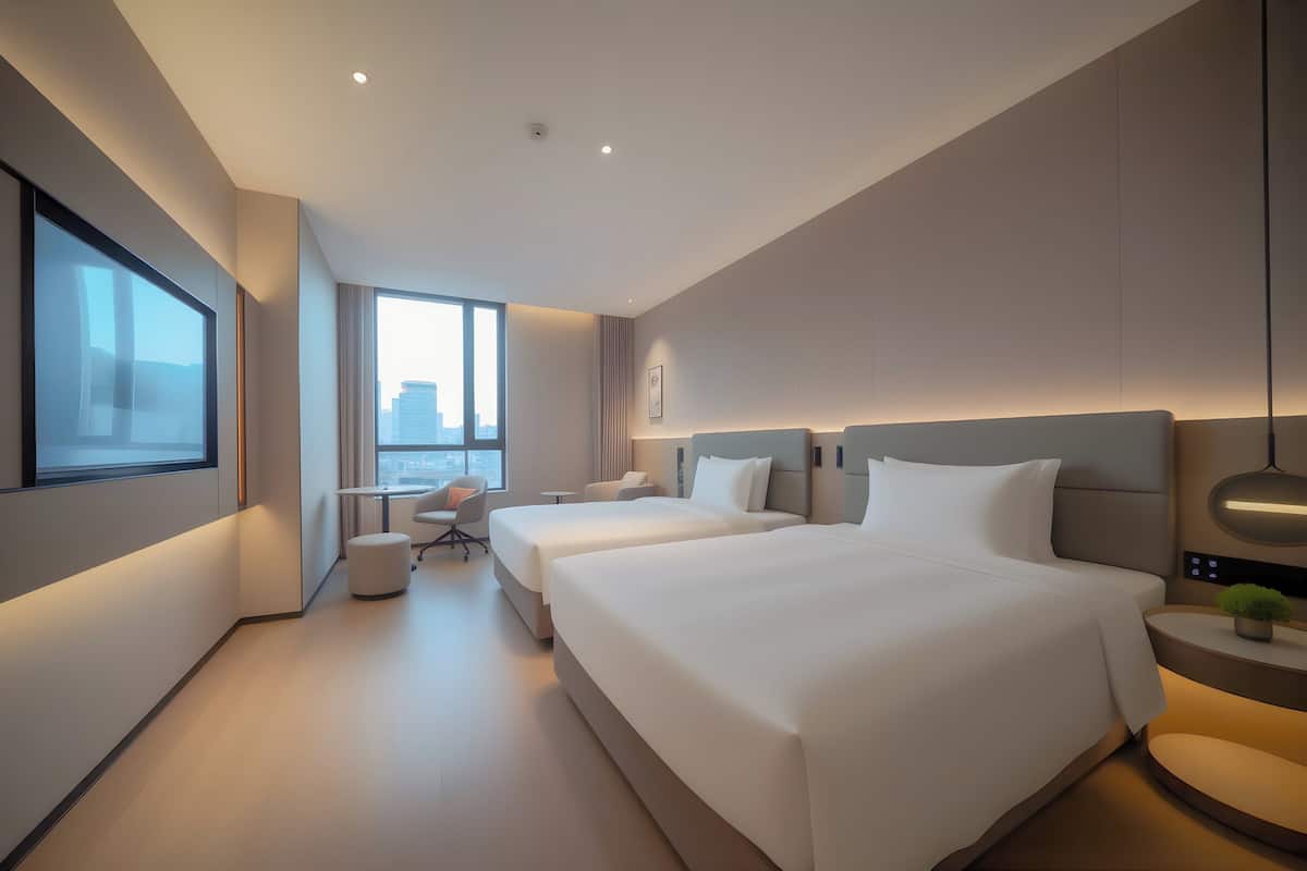 2 Queen Standard City View | Premium bedding, down comforters, laptop workspace, blackout drapes