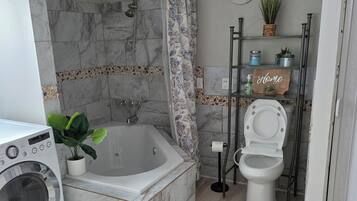 Shower, jetted tub, hair dryer, bidet