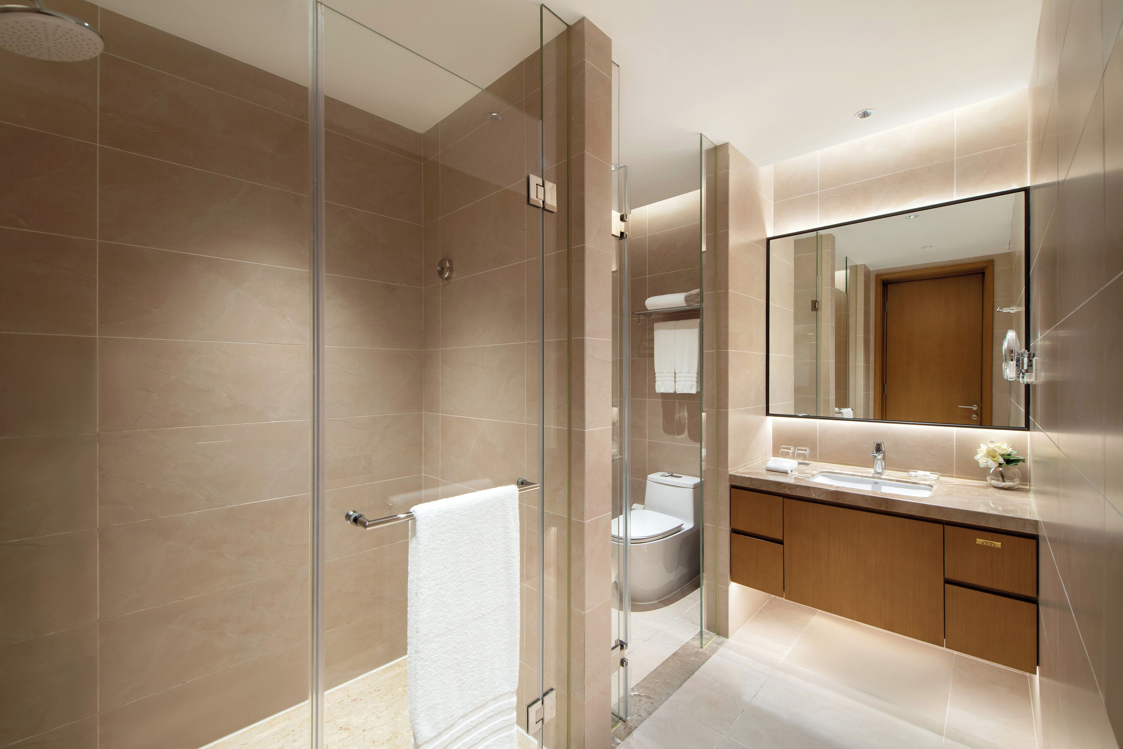 Designer toiletries, hair dryer, bathrobes, slippers
