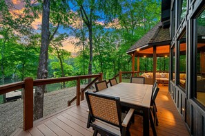 Outdoor dining - Riverfront 3 bedroom cabin with game/bunkroom and apartment above (Broken Bow)