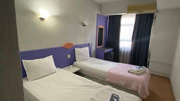 Desk, laptop workspace, bed sheets