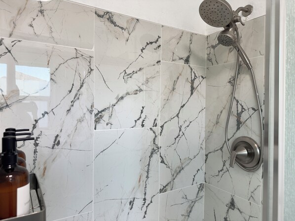 Shower, hair dryer, towels, soap