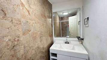 Shower, towels, soap, toilet paper