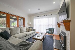 TV, fireplace, books, offices