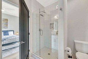 Shower, hair dryer, towels, shampoo