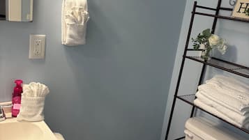 Shower, towels, soap, shampoo