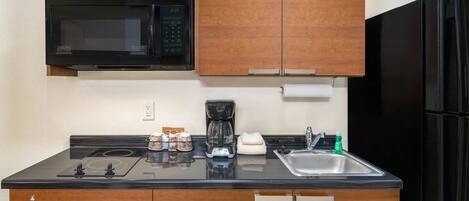 Fridge, microwave, stovetop, coffee/tea maker