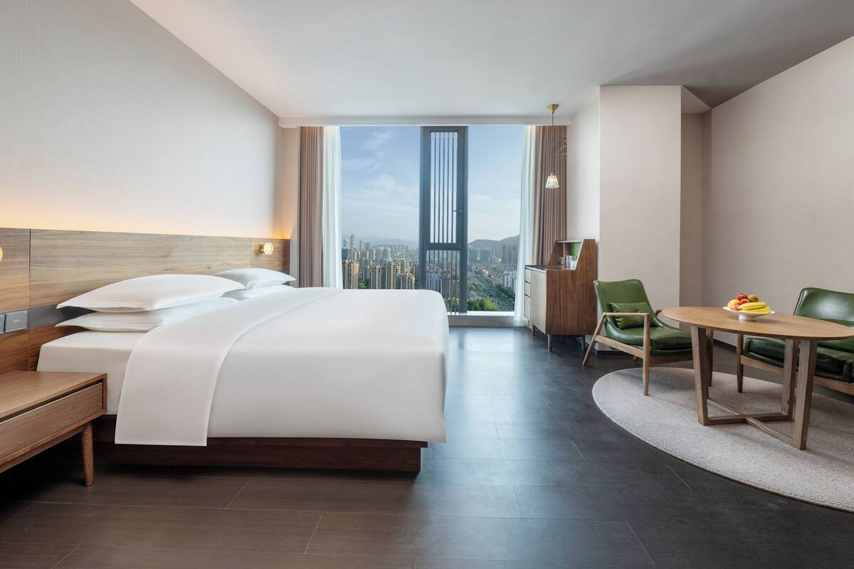 Luxury Suite, City View | Blackout drapes, soundproofing, iron/ironing board, free WiFi