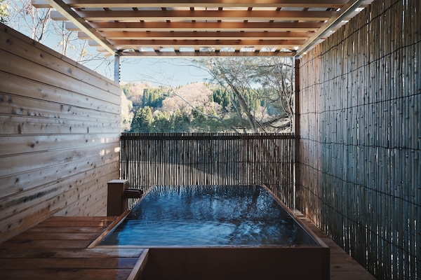 Luxury Suite, Accessible Bathtub, Balcony | Bathroom | Separate tub and shower, spring water tub, free toiletries, hair dryer