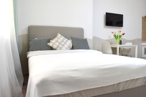 1 habitación, tabla de planchar con plancha, wifi y ropa de cama 
