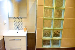 Shower, hair dryer, towels, soap