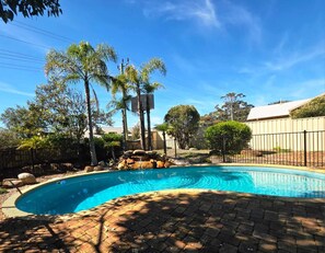 Outdoor pool, open 9:00 AM to 5:00 PM, pool loungers