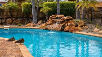 Outdoor pool, open 9:00 AM to 5:00 PM, pool loungers