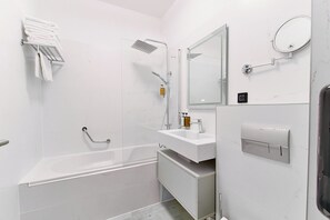 Apartment | Bathroom | Bathtub, hair dryer, slippers, towels - Bach Apartments 2 (Sibiu)