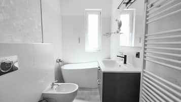Penthouse | Bathroom | Hair dryer, slippers, towels, toilet paper