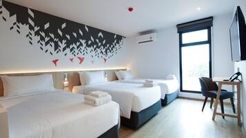 Deluxe Triple Room, City View | In-room safe, desk, soundproofing, free WiFi