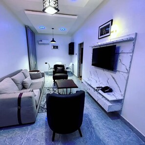 Family Apartment, Balcony, City View | Living area | Flat-screen TV - Bott Apartment (Abuja)