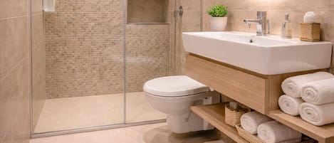 Hydromassage showerhead, designer toiletries, hair dryer, bathrobes