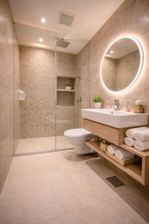 Hydromassage showerhead, designer toiletries, hair dryer, bathrobes