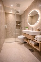 Hydromassage showerhead, designer toiletries, hair dryer, bathrobes