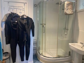 Shower, hair dryer, towels, toilet paper