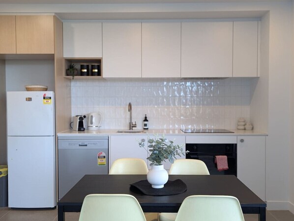 Fridge, microwave, oven, stovetop - "elevate"  Two Bedroom Apartment in Woden (Phillip)