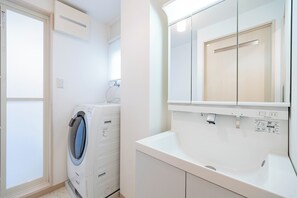 Family Apartment, Balcony | Bathroom | Slippers - Maison Creole Sanno (Osaka)