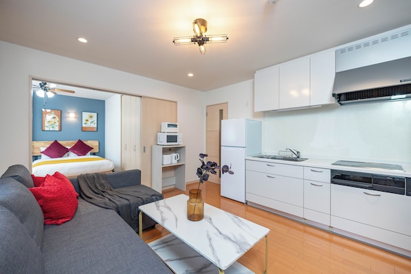 Apartamento família, sacada | Área de estar