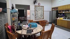 A modern kitchen with a dining area. - Imperia Sky Garden Dream Loft (Hanoi)