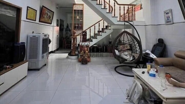 A spacious living area with a staircase, a hanging chair, and a sofa. - Imperia Sky Garden Dream Loft (Hanoi)