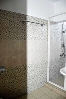 Standard Room, Courtyard View | Bathroom | Shower, free toiletries, hair dryer, towels