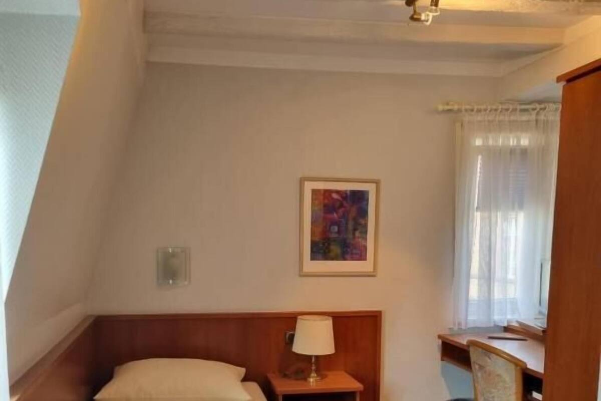 Comfort Single Room, Non Smoking | Minibar, desk, laptop workspace, blackout drapes