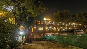 A building with a sign reading "Treebo Executive Suites." - Treebo Executive Suites (Gandhinagar)