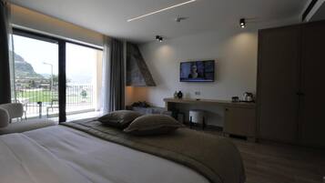 Executive Suite, Balcony, Garden View | Minibar, in-room safe, desk, laptop workspace