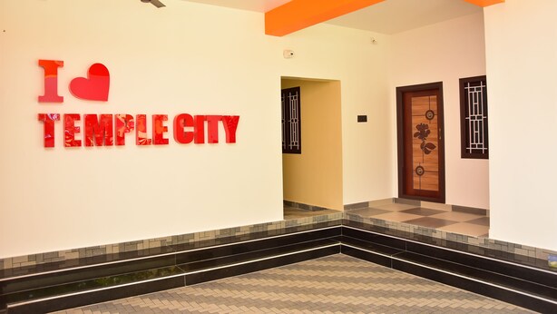 A hallway with a sign reading "I ♥ TEMPLE CITY" and a ceiling fan.
