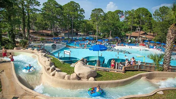 A water park with multiple pools, slides, and a wave pool.