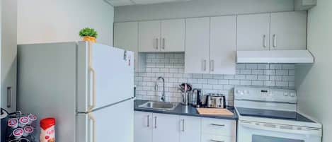 Fridge, microwave, stovetop, coffee/tea maker