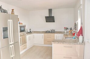 Fridge, coffee/tea maker, toaster, cookware/dishes/utensils