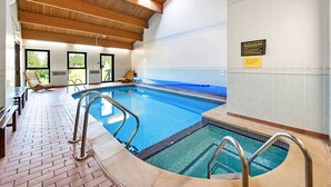 An indoor swimming pool with a wooden ceiling, tiled walls, and a bench area. - Wonderful  villa for 4 guests with hot tub, WIFI, pool, terrace and pets allowed (Northallerton)