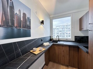 Family Apartment, Courtyard View | Private kitchen | Espresso maker, electric kettle, toaster