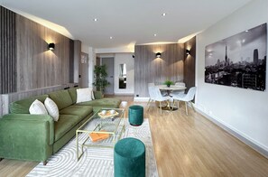 Family Apartment, Courtyard View | Living area | 80-cm Smart TV with digital channels
