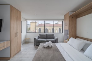 Apartamento superior | Roupas de cama premium, Wi-Fi de cortesia, roupa de cama