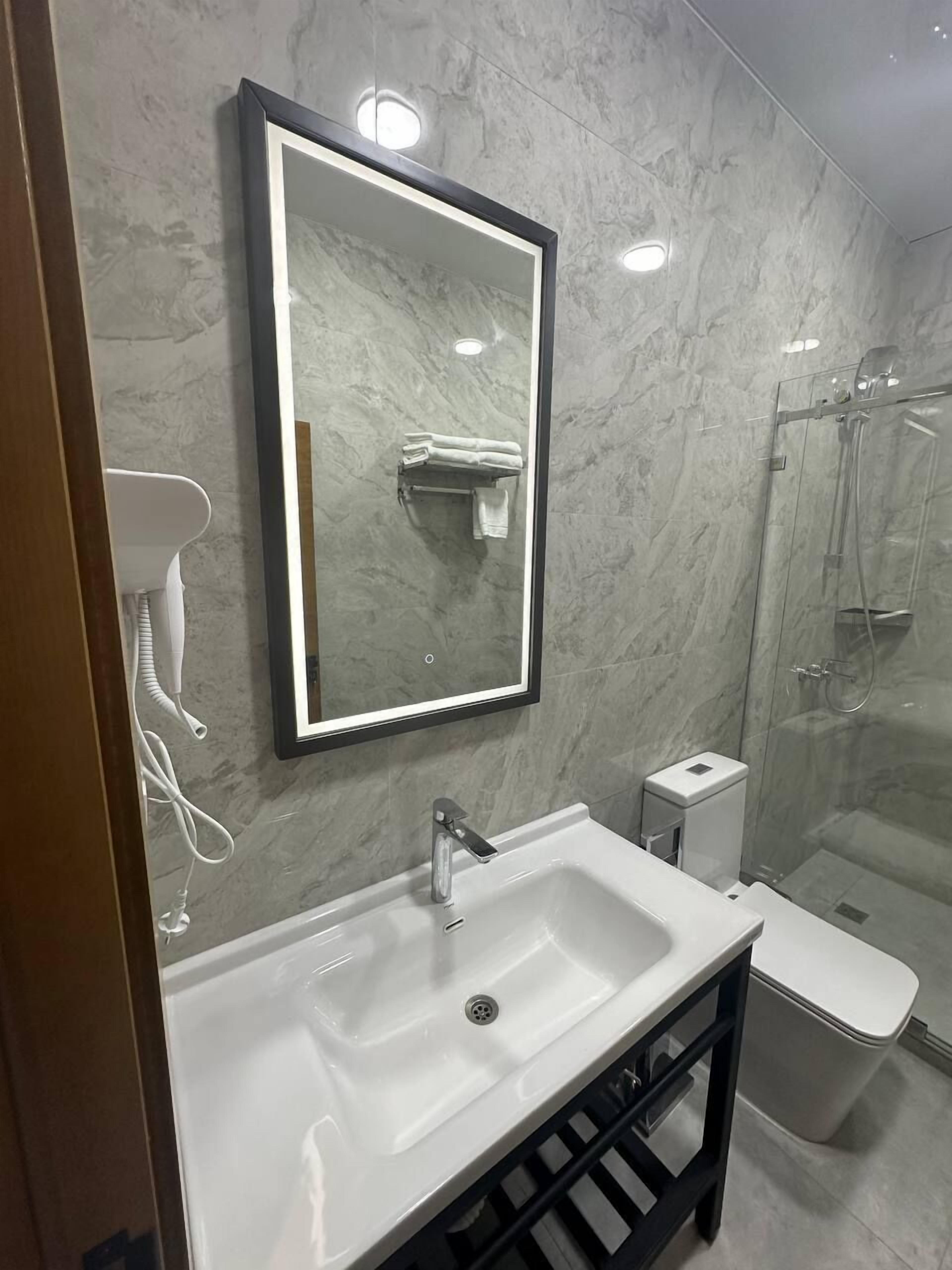 Shower, hair dryer, slippers, soap