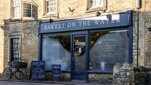 A bakery named "Bakery on the Water" with a sign above the entrance.