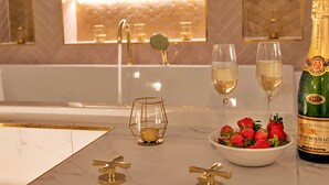 A luxurious bathroom with a marble countertop, gold fixtures, and a bottle of champagne. - Stunning  villa for 12 guests with WIFI, hot tub and terrace (Nottingham)
